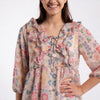Printed Peplum Top With Ruffle and Tie-Up Neck Detail