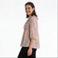 Printed Peplum Top With Ruffle and Tie-Up Neck Detail