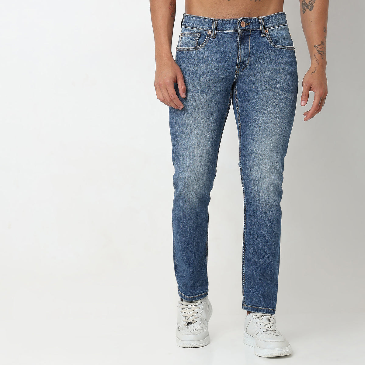 Tapered Fit Solid Mid Rise Jeans