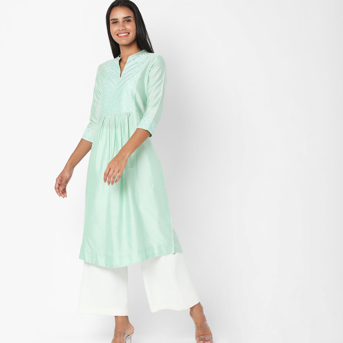 Women Wearing Regular Fit Embroidered Kurta