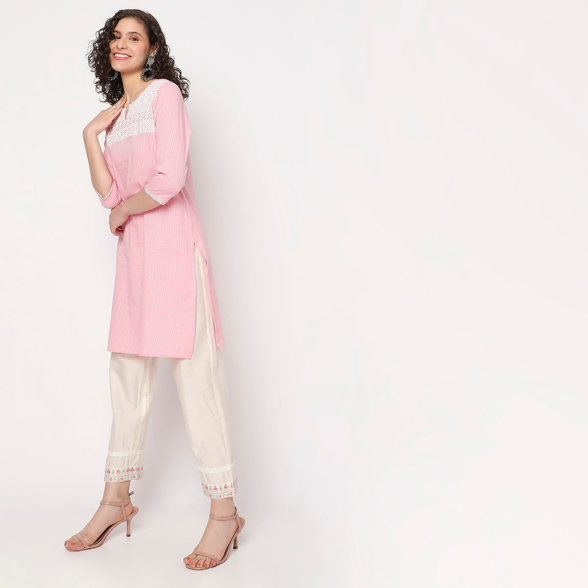 Women Wearing Straight Fit Embroidered Kurta