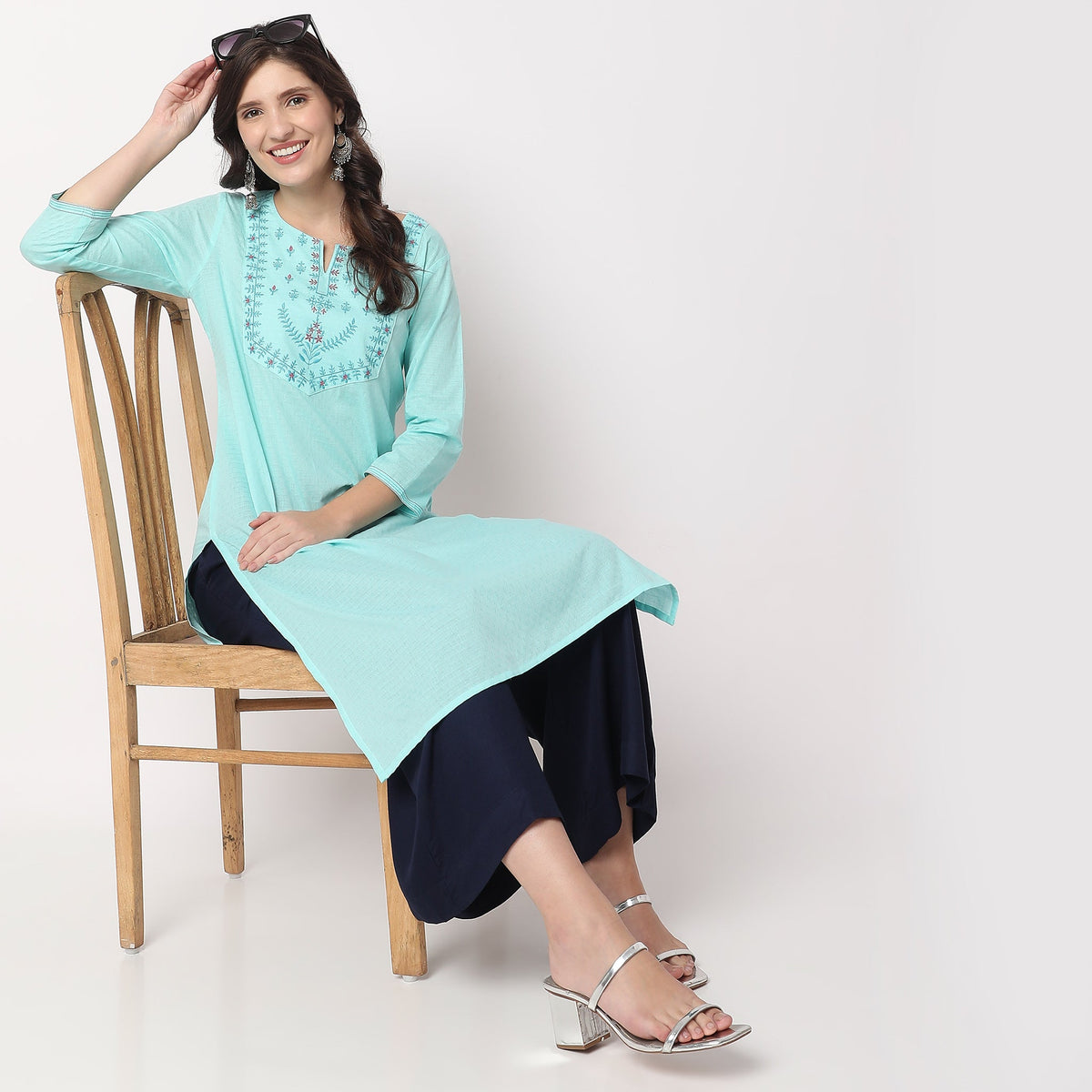 Women Wearing Straight Fit Embroidered Kurta