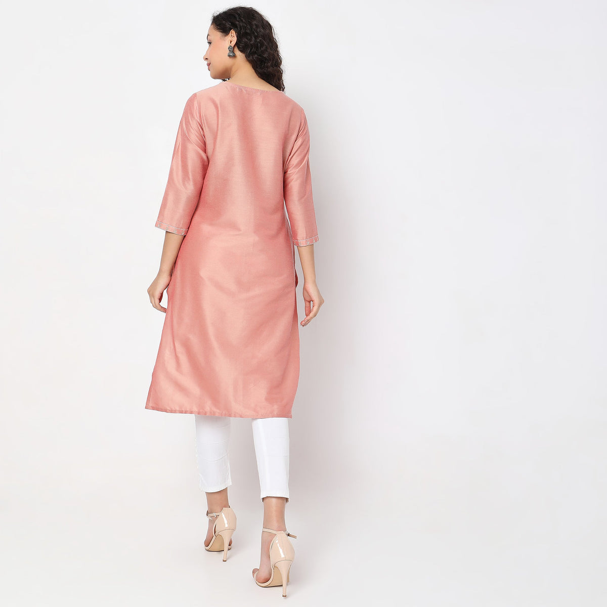 Women Wearing Straight Fit Solid Kurta