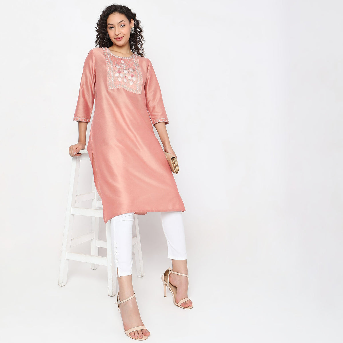 Women Wearing Straight Fit Solid Kurta