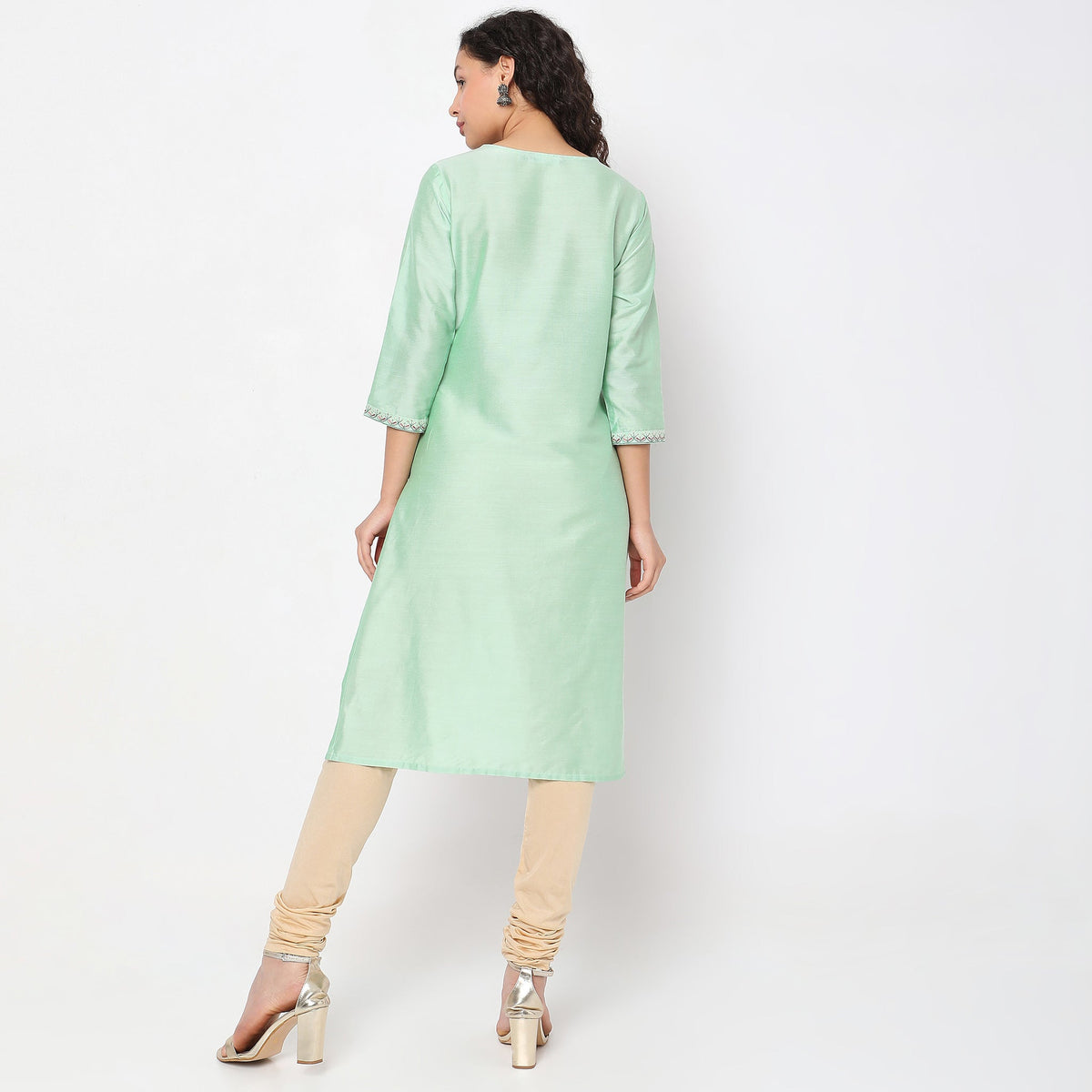 Women Wearing Straight Fit Solid Kurta