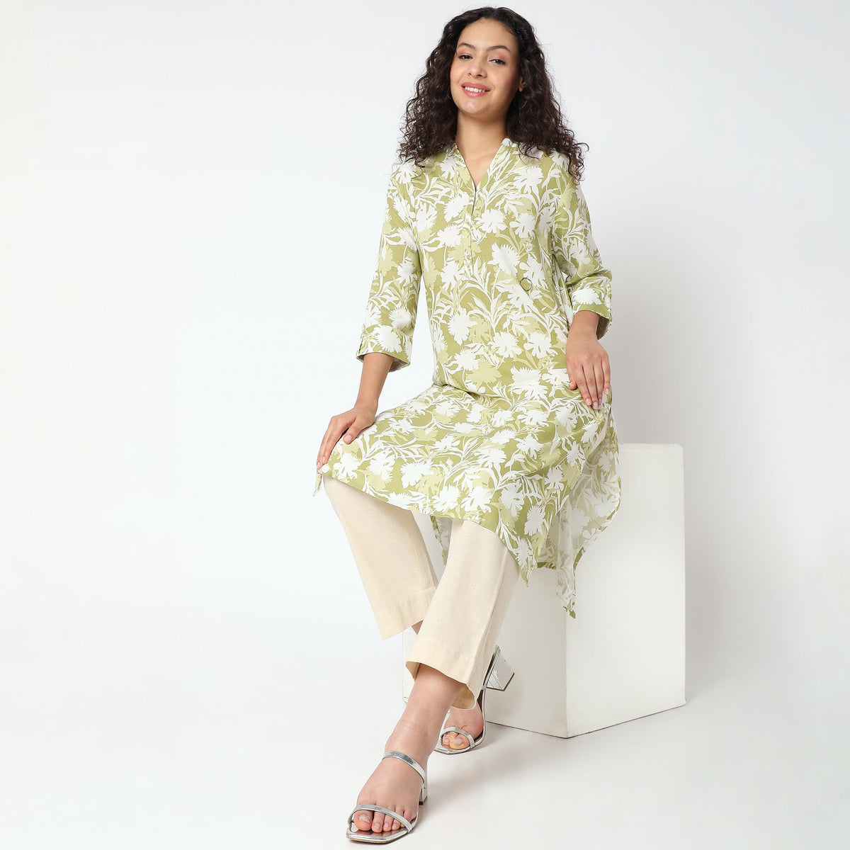 Women Wearing Straight Fit Solid Kurta