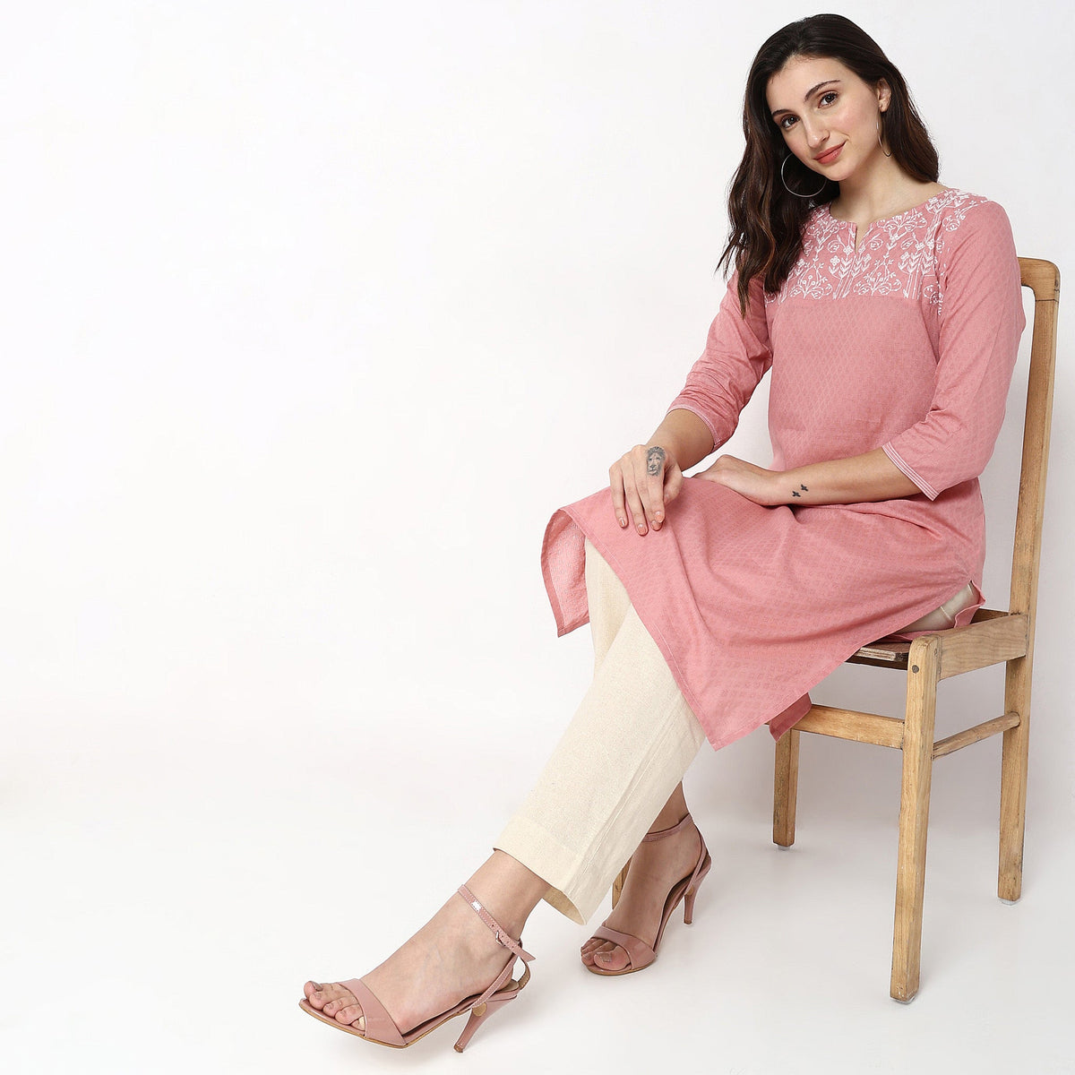 Women Wearing Straight Fit Solid Kurta