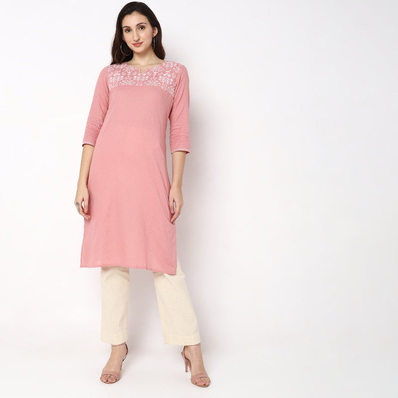 Women Wearing Straight Fit Solid Kurta