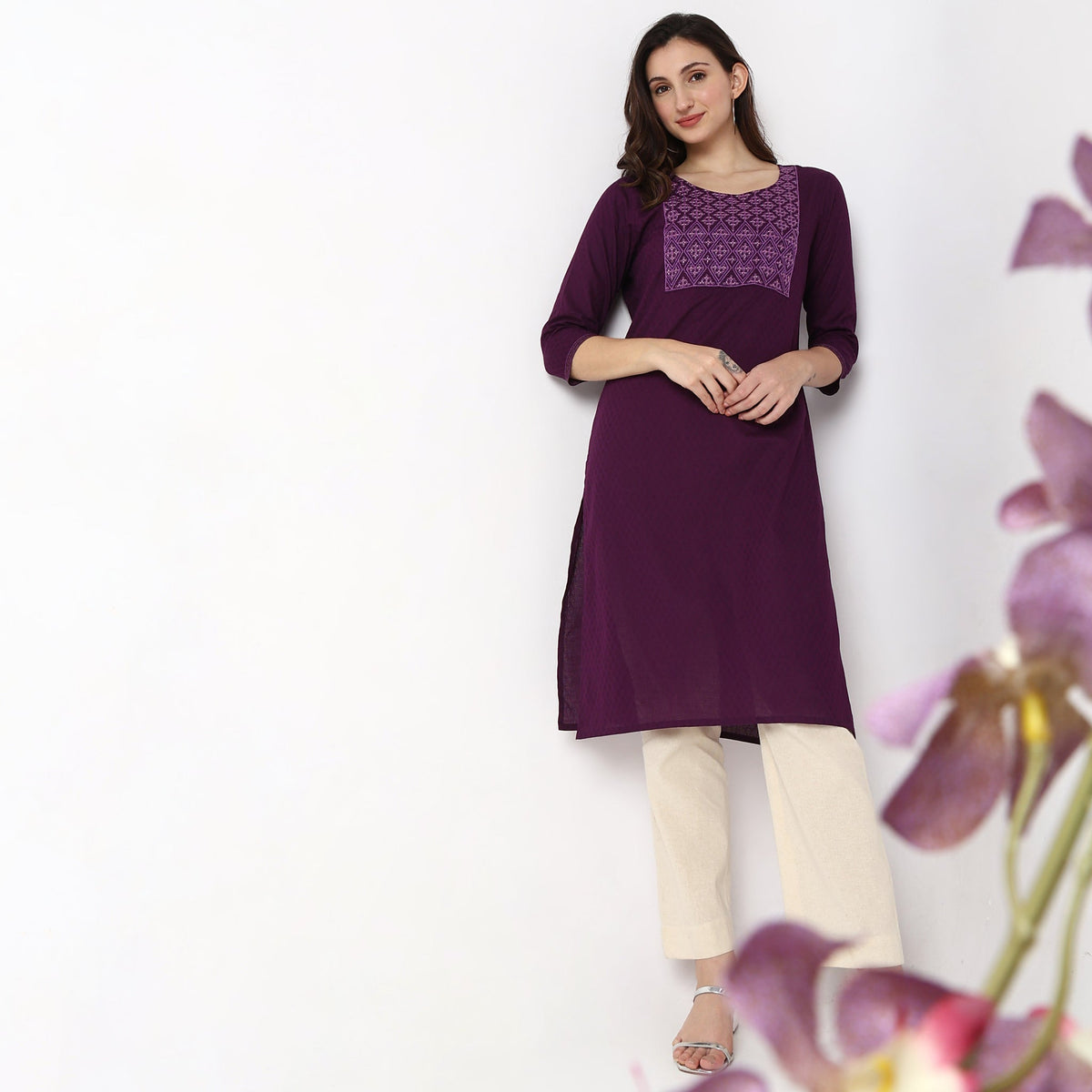 Women Wearing Straight Fit Solid Kurta