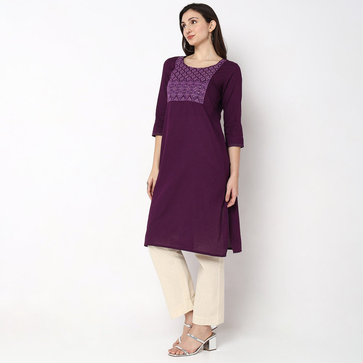 Women Wearing Straight Fit Solid Kurta