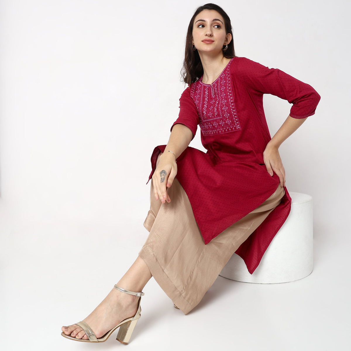 Women Wearing Straight Fit Solid Kurta