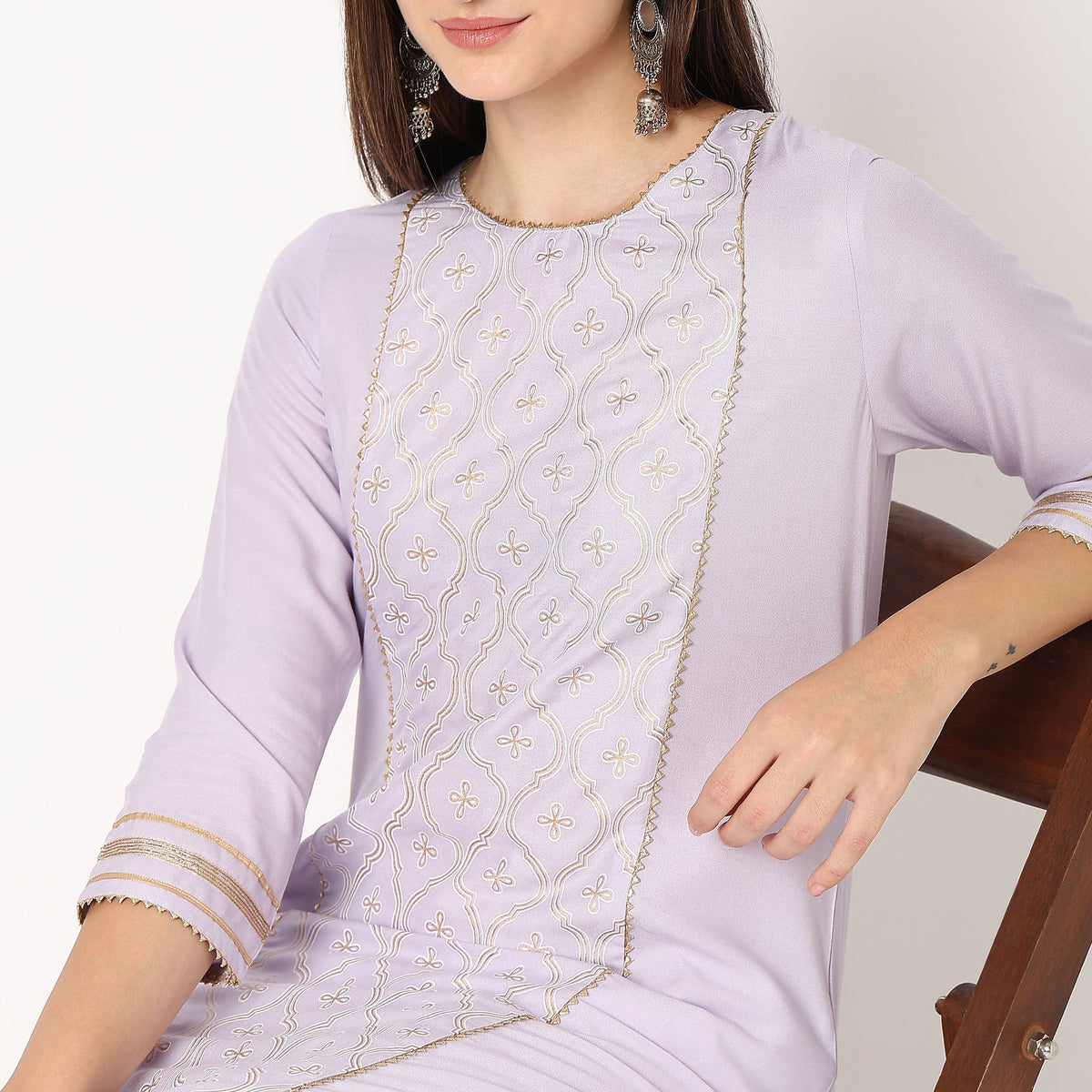 Women Wearing Straight Fit Embroidered Kurta