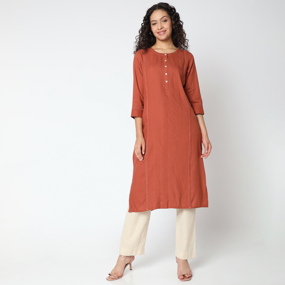 Women Wearing Straight Fit Solid Kurta