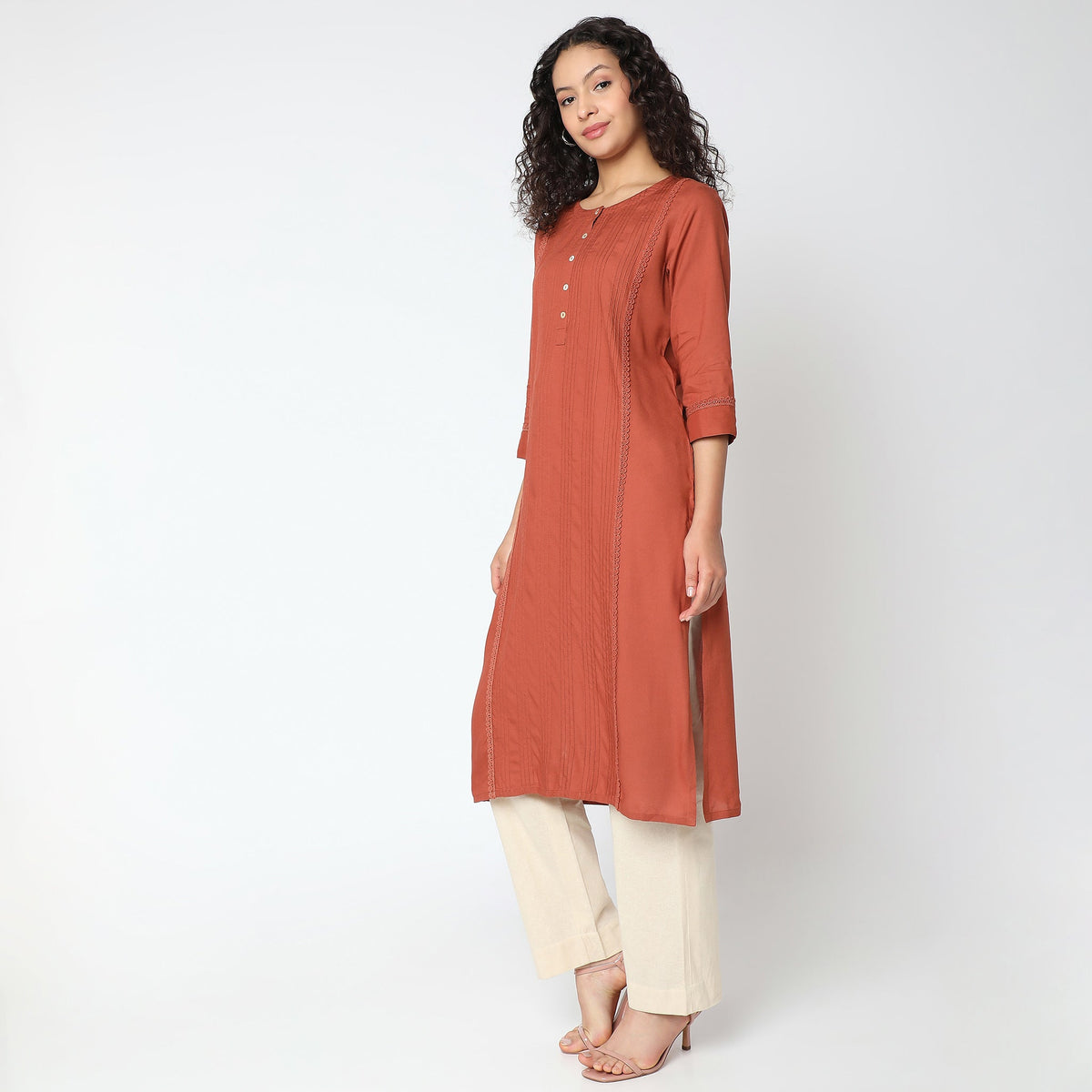 Women Wearing Straight Fit Solid Kurta