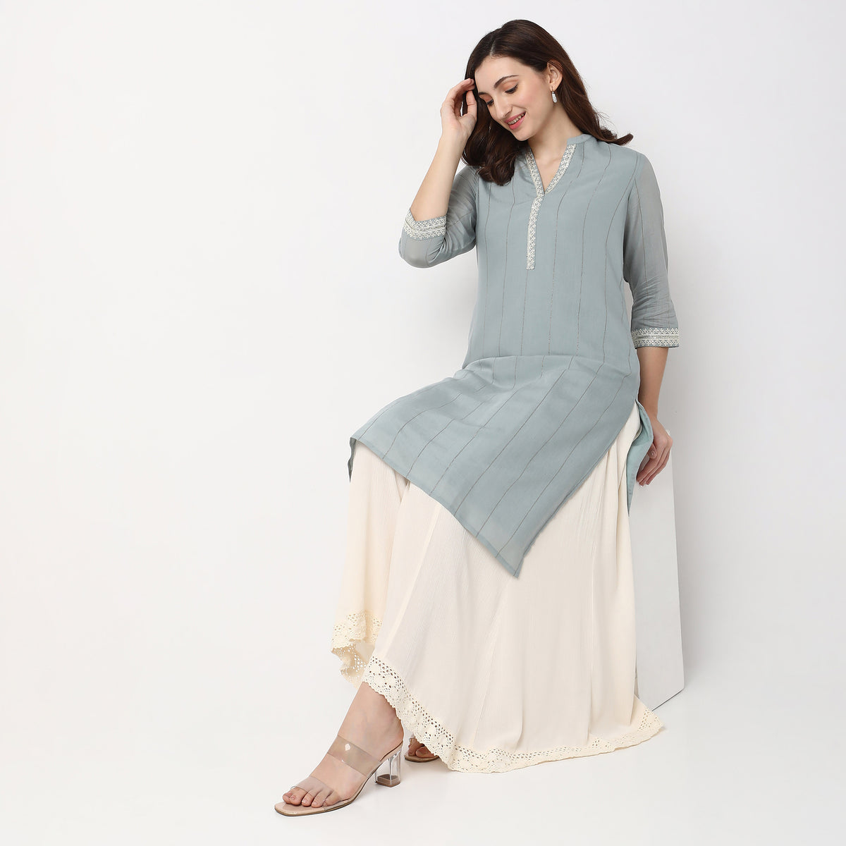 Women Wearing Straight Fit Embroidered Kurta