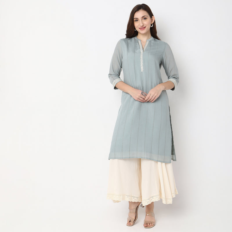 Women Wearing Straight Fit Embroidered Kurta