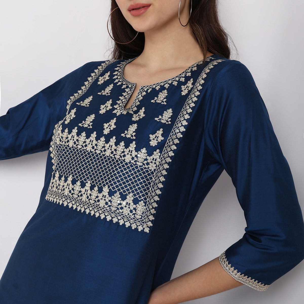 Women Wearing Straight Fit Embroidered Kurta