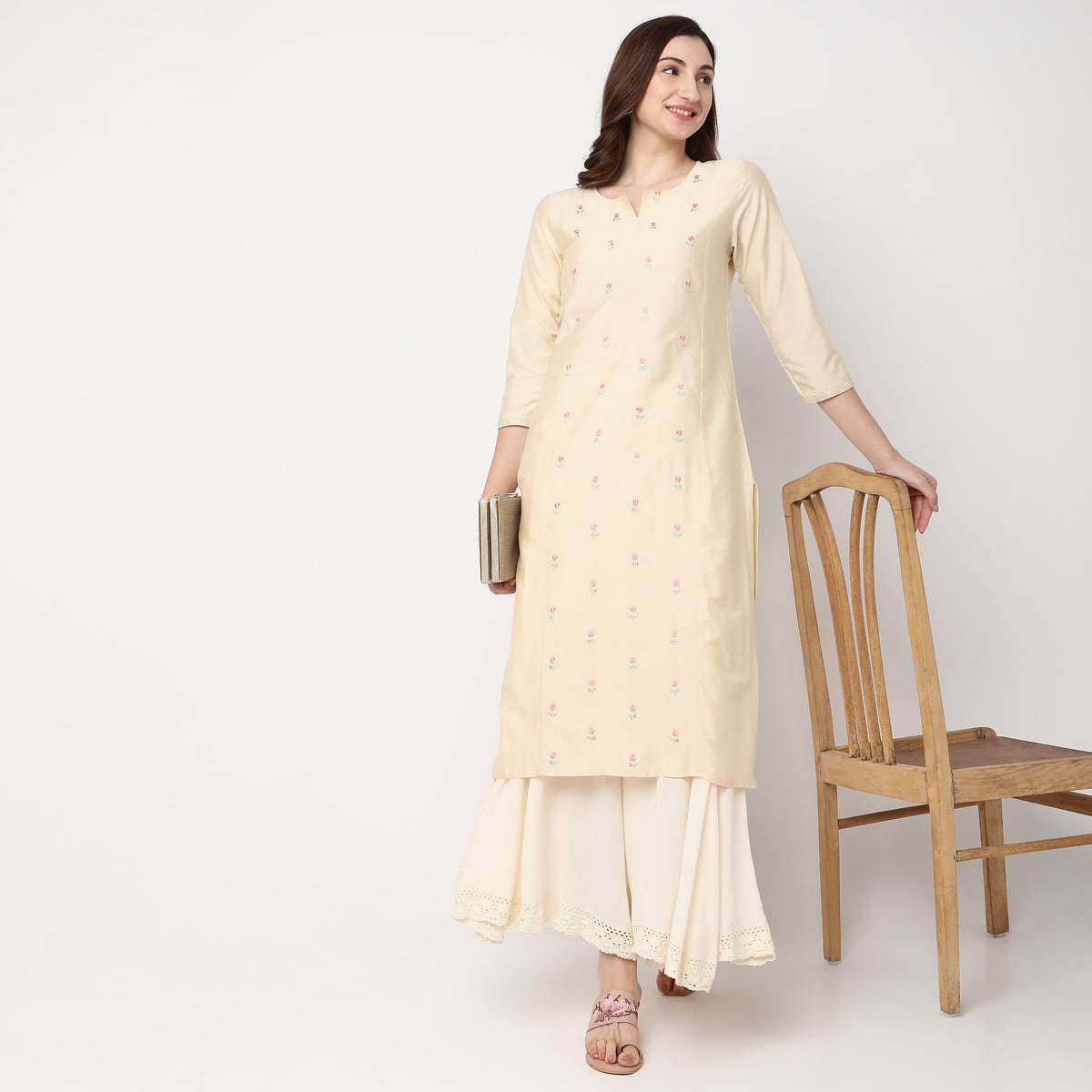 Women Wearing Straight Fit Embroidered Kurta