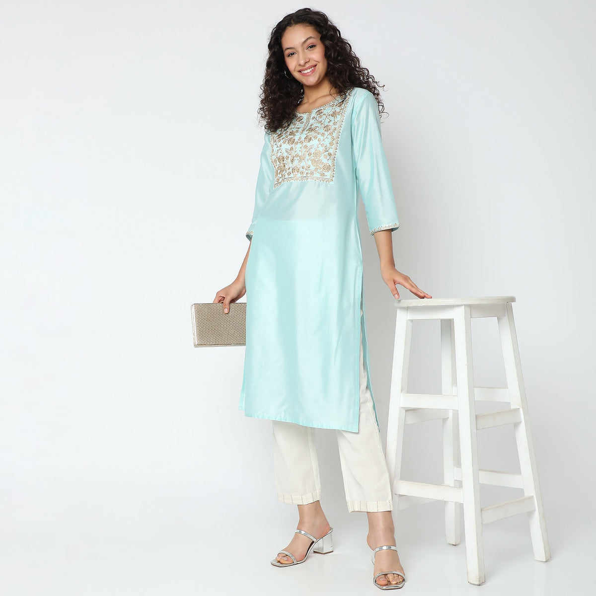 Women Wearing Straight Fit Embroidered Kurta