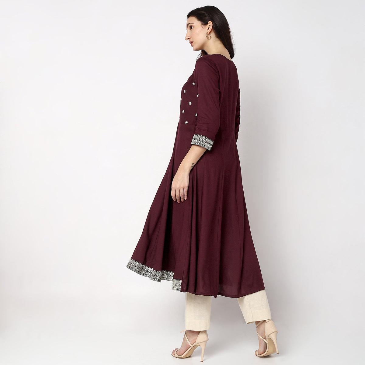 Women Wearing Flare Fit Embroidered Kurta