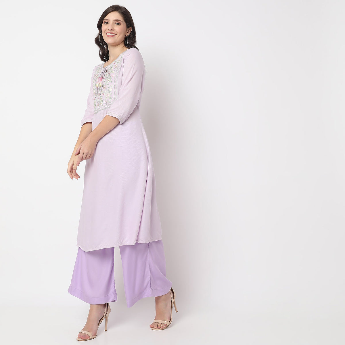 Women Wearing Straight Fit Embroidered Kurta