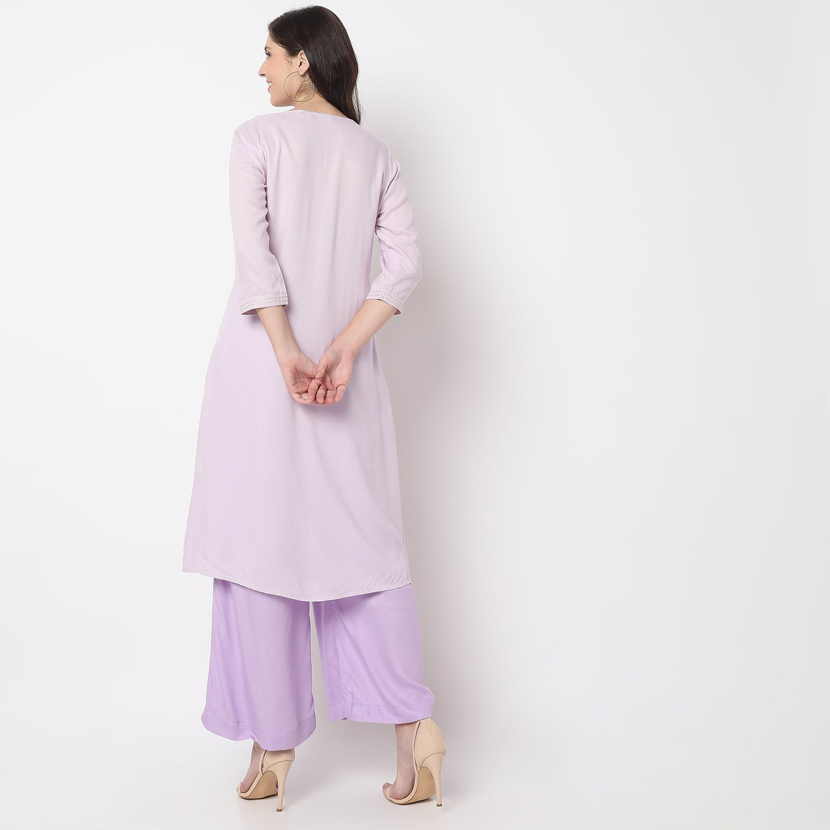 Women Wearing Straight Fit Embroidered Kurta