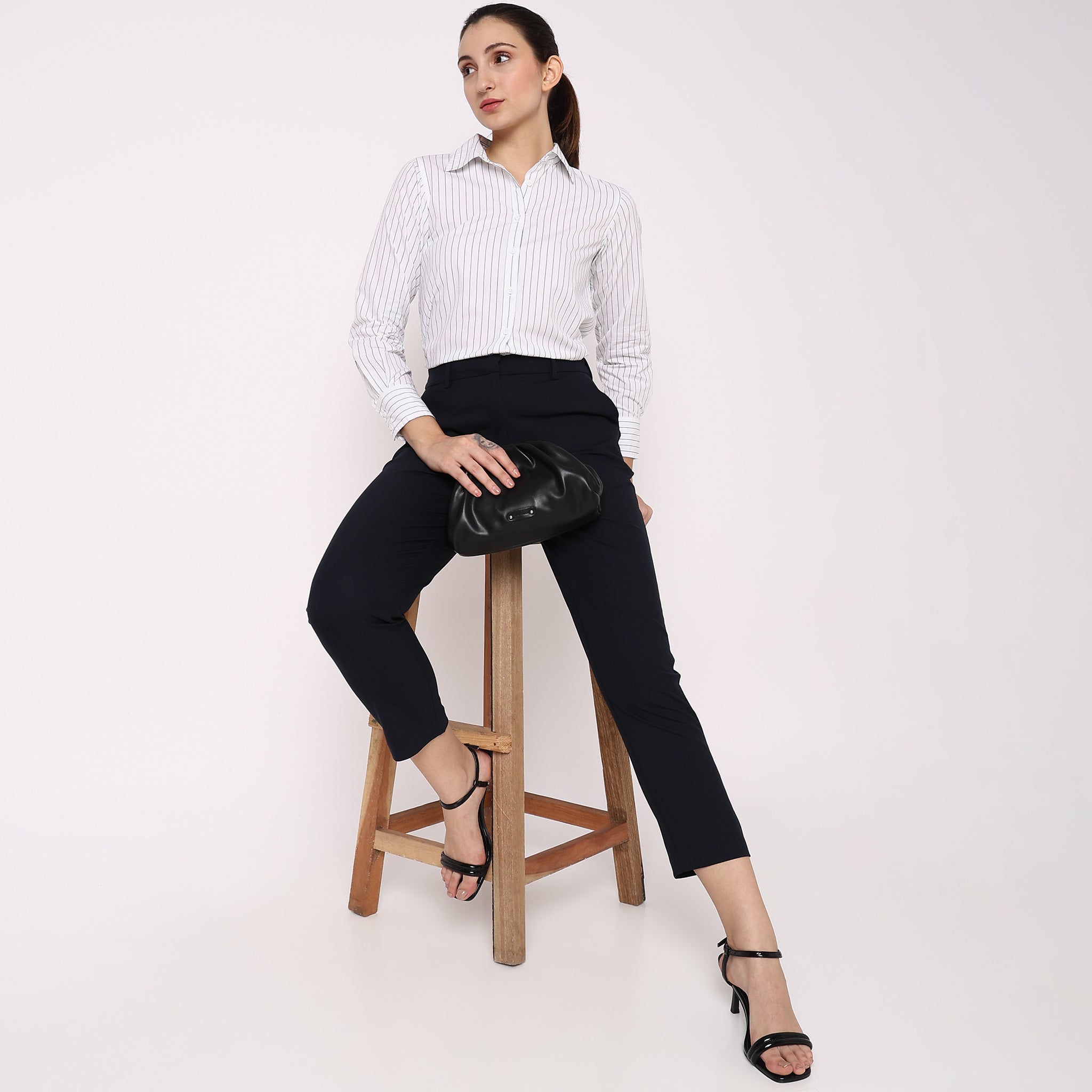 Women Wearing Straight Fit Solid Mid Rise Trouser