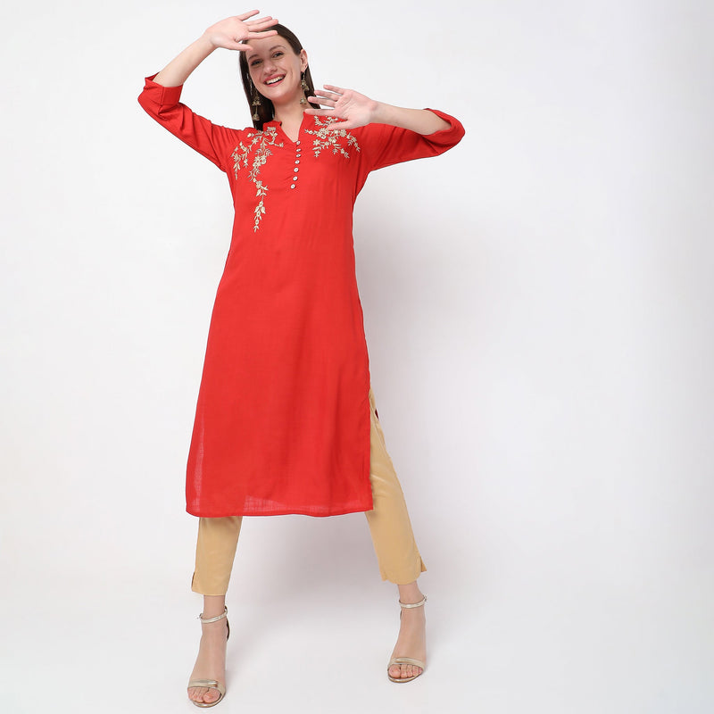 Women Wearing Straight Fit Embroidered Kurta