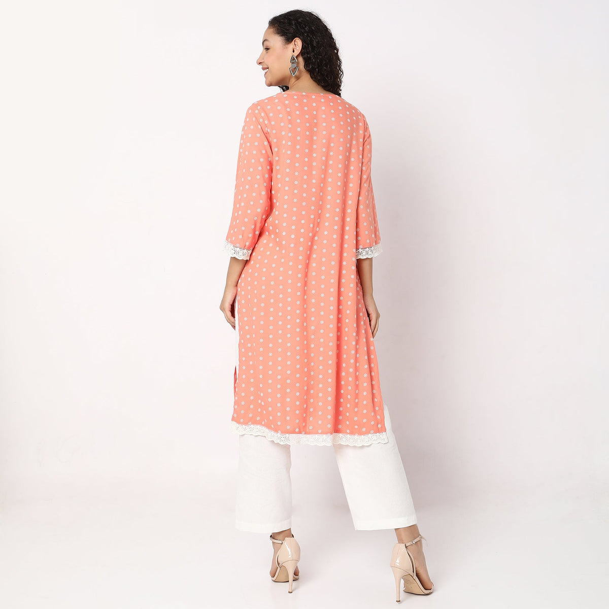 Women Wearing Straight Fit Embroidered Kurta