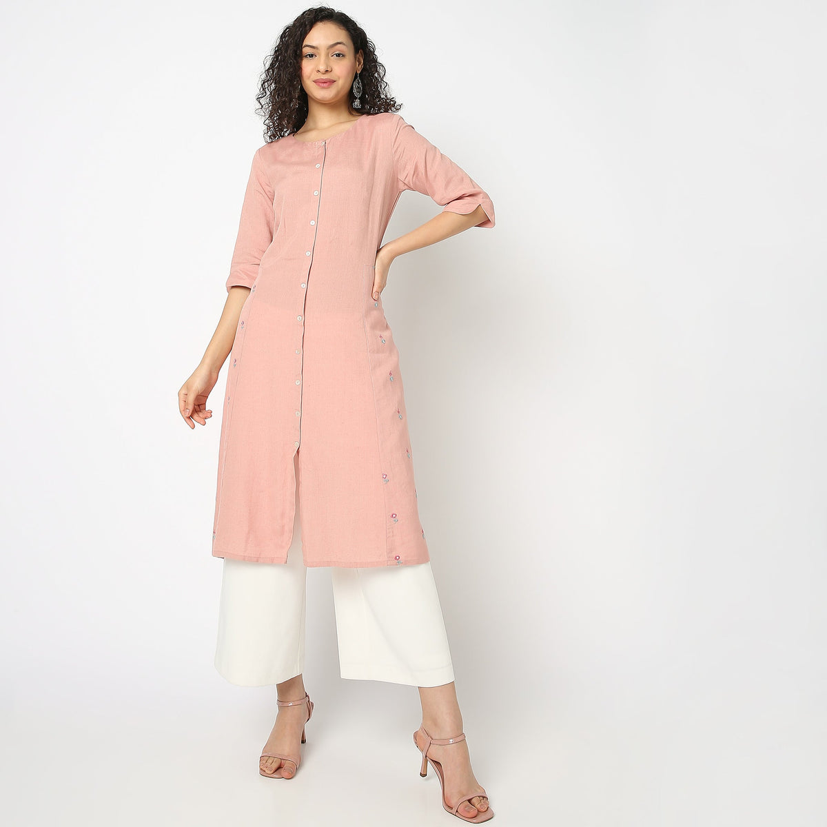 Women Wearing Regular Fit Solid Kurta