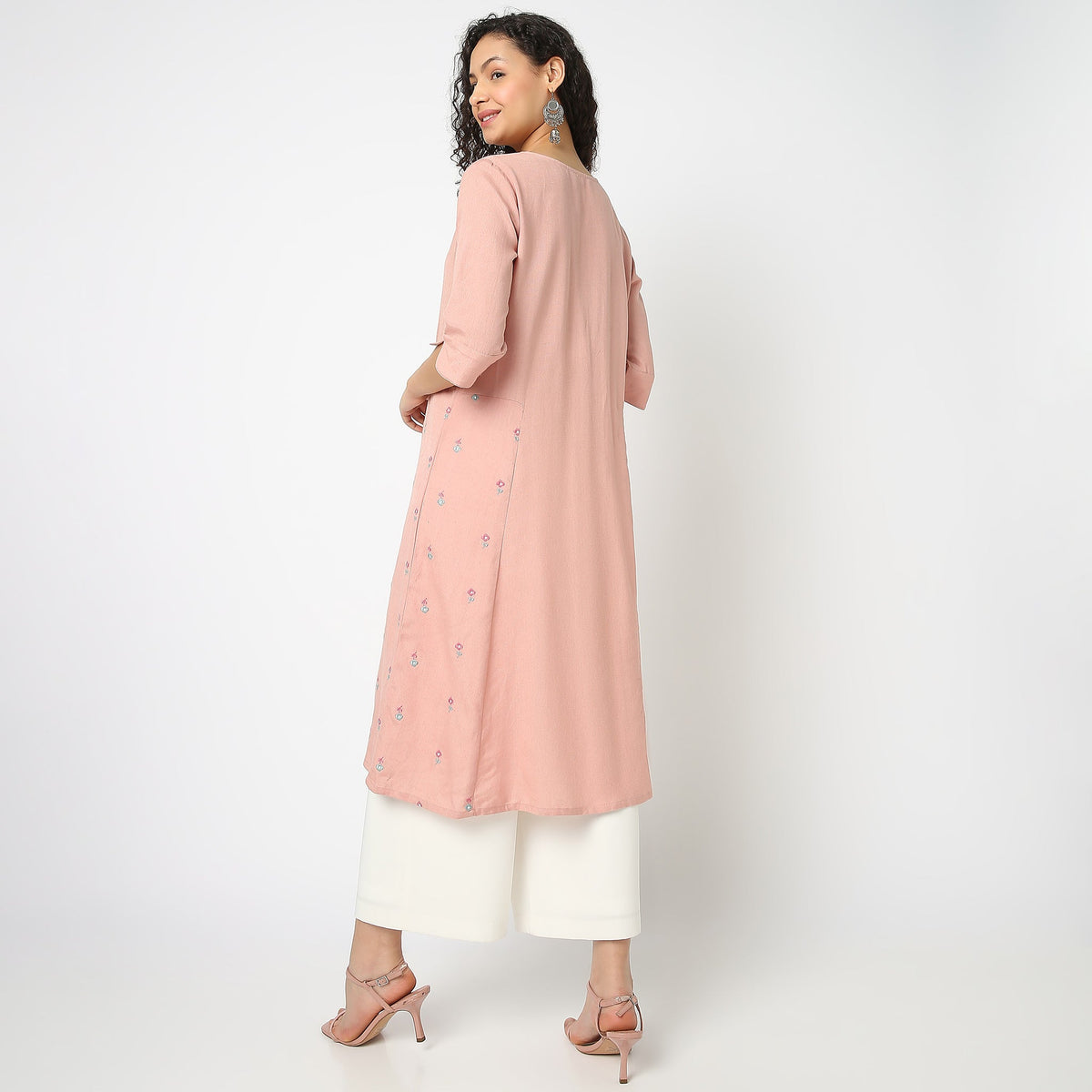 Women Wearing Regular Fit Solid Kurta